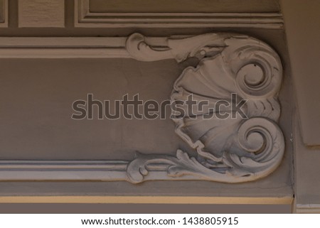Elements of architectural decorations of buildings, gypsum stucco, wall texture, plaster ornaments and patterns. On the streets in Georgia, public places.