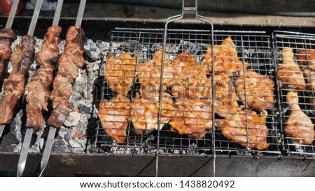 Background of grilled assorted meat beef, pork, chicken for a party top view