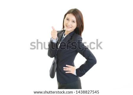 Business woman showing thumbs up sign.