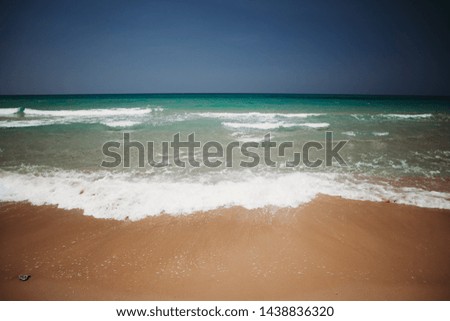 Mediterranean beach with turquoise water in sunny weather