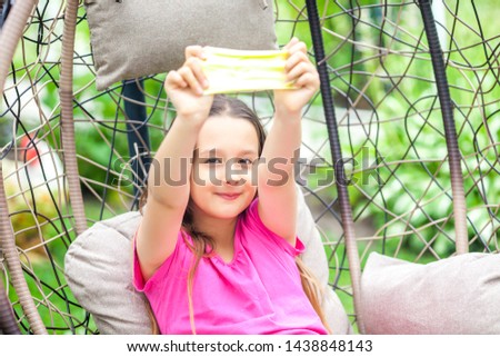 Kid Playing with Handgum in nature
