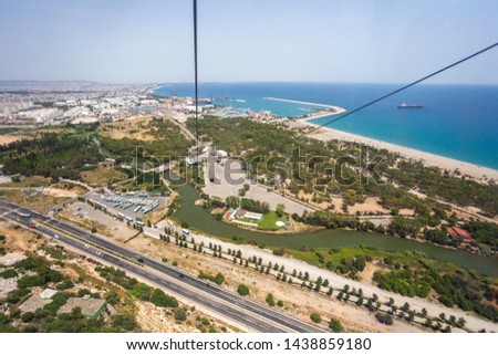 Panoramic aerial view of Antalya city from cabin of funicular, Tunektepe, Turkey. Horizontal color photography.