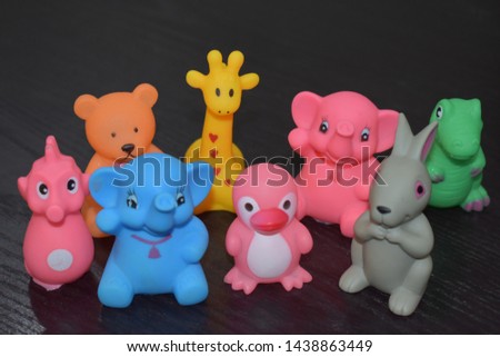 Colorful lovely rubber toys in black background