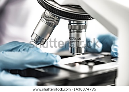 close-up of Microscope lens, science tools microscope in laboratory Royalty-Free Stock Photo #1438874795