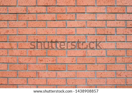 Brick wall Smooth orange and brick wall texture designbackground