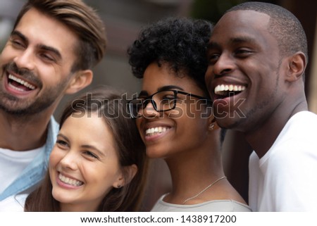 Close up portrait of smiling multiracial millennial friends laugh stand posing for group picture together, happy diverse young people feel overjoyed look at camera making selfie. Friendship concept