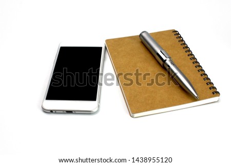 smartphone,memo pad and pencil on white desk