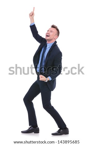full length picture of a young business man pointing and looking upwards with a smile on his face. on white background