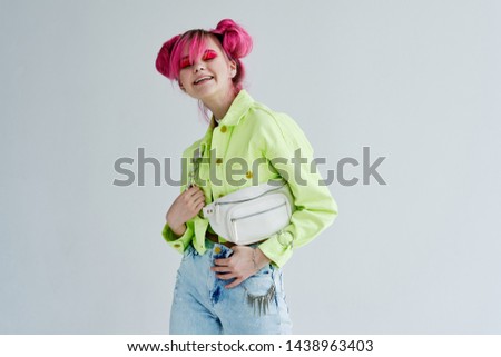 woman in a green jacket with a beauty bag