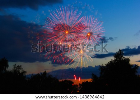 fireworks in the night sky against a background of clouds
