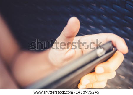 A young boy with sn electronic device