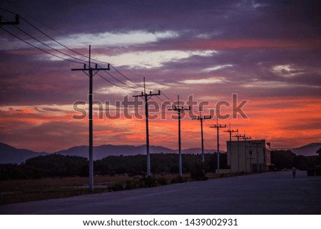 
Electric poles and backgrounds are the sky in the evening.