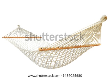 A hammock is a sling made of fabric, rope, or netting, suspended between two or more points, used for swinging, sleeping, or resting isolated on white background. This has clipping path.