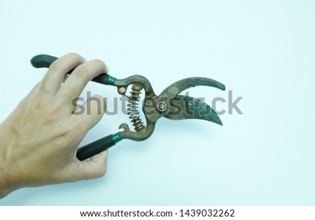 man hand holding Wire cutting pliers on a white background
