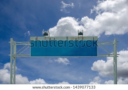 Blank signpost on the sky background