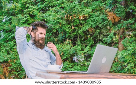 Bearded hipster laptop surfing internet. Reporter journalist daily routine. Working online. Online mass media worker. Write article for online magazine. Man looking for inspiration. Find topic write.