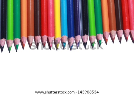 colored pencils neatly lined up isolated on white background
