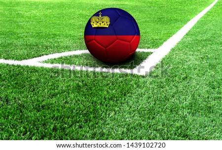 soccer ball on a green field, flag of Liechtenstein