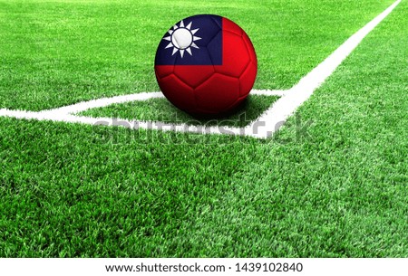 soccer ball on a green field, flag of Taiwan