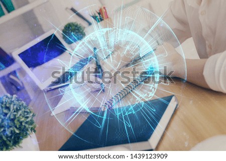 International business hud over woman's hands writing background. Concept of hard work. Double exposure