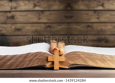 the wooden cross hang on stack of