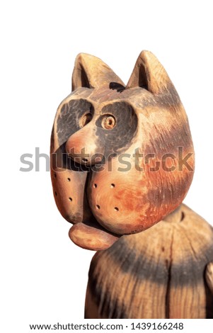 toy wooden head cat closeup, isolated white background.