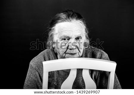 Portrait of elderly woman. Attention. Toned.