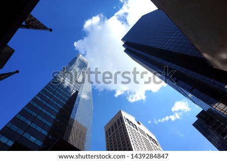 New York City buildings against blue sky
