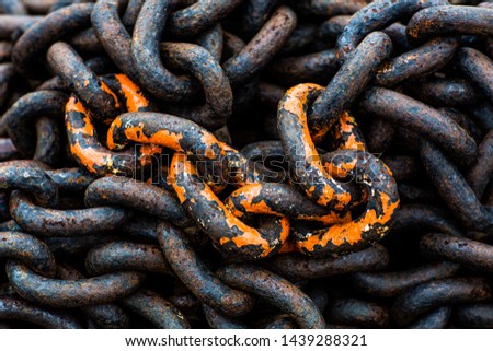 Old rusted chains with few colorful elements still visible
