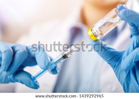 injecting injection vaccine vaccination medicine flu man doctor insulin health drug influenza concept - stock image Royalty-Free Stock Photo #1439292965