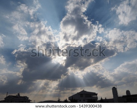 Rays of light shining through dark clouds city Ankara, Turkey