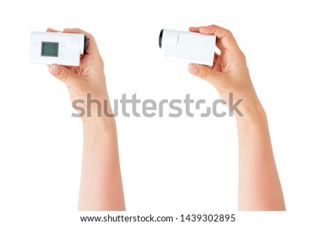 Portable video camera on a white background. Action camera close up.