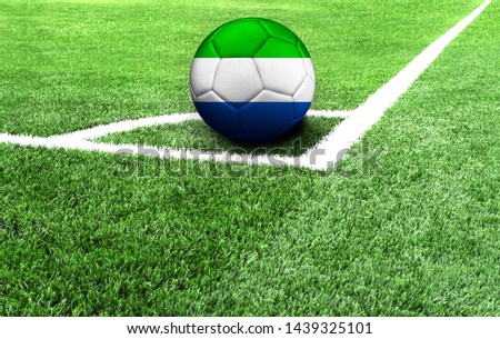 soccer ball on a green field, flag of Sierra Leone