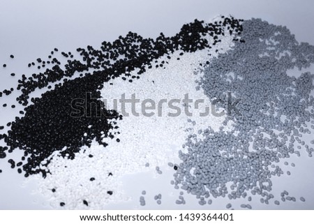 Granules of termoplastic elastomer on a white background Royalty-Free Stock Photo #1439364401