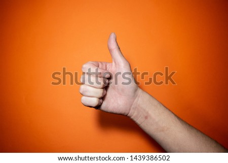 Hands making positive symbols with colourful background