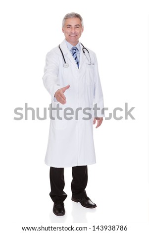 Portrait Of Happy Mature Male Doctor Offering Handshake Isolated Over White Background