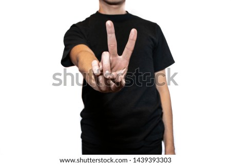 Man making positive symbols with his hands, using a white background
