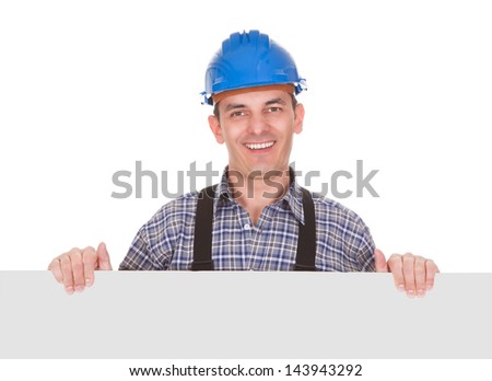 Happy Male Worker With Placard Over White Background