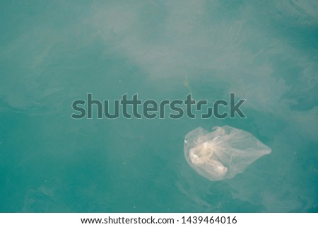 Trash, plastic, garbage, bottle... environmental pollution on the beach. Royalty high-quality free stock photo image of trash, plastic bottle on the beach. Waste that polluted the ocean environment