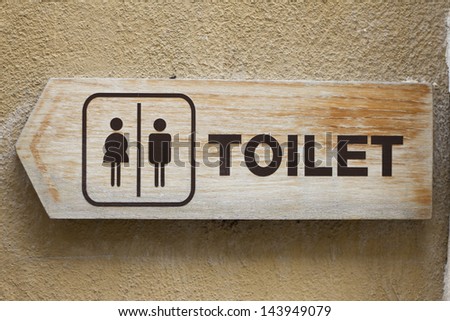 Toilet sign made of wooden