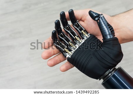 Bionic hand. Prosthetic human limbs. Manufacturing of artificial limbs from carbon. Royalty-Free Stock Photo #1439492285