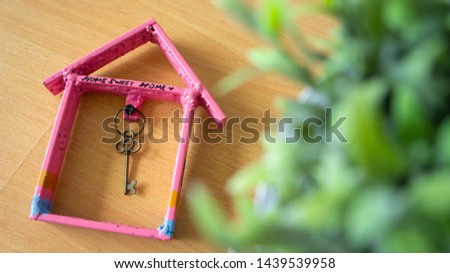 House or home on wooden background.Property concept.