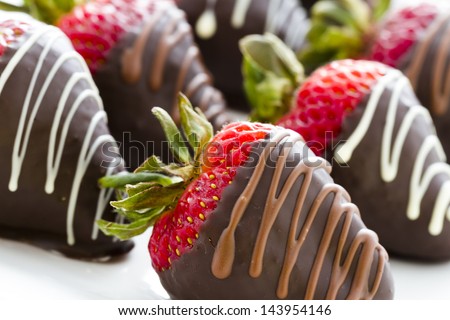 Chocolate dipped strawberries at dessert bar. Royalty-Free Stock Photo #143954146