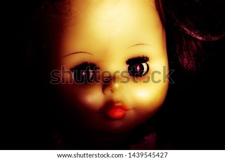 Portrait vintage spooky devil doll.