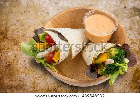 Salad Kebab, Pita bread, Tortilla wrap with mixed vegetable, in wooden bowl, healthy meal for grab & go food, with salad sauce thousand island dressing, pen tool die-cut with path for design element Royalty-Free Stock Photo #1439548532