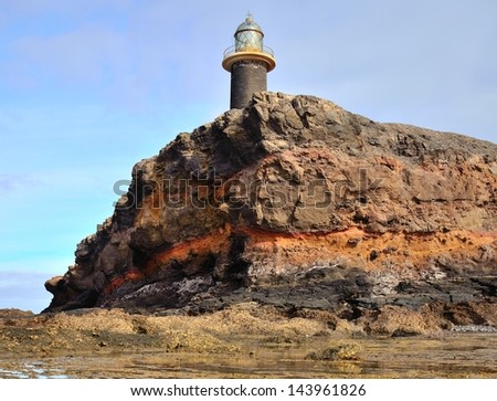 Lighthouse on cliff of colors, tip of Jandia,coast of Fuerteventura, Canary islands