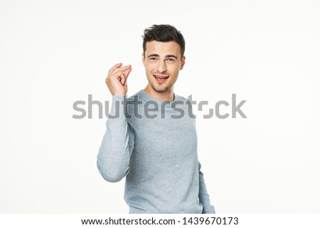 Cropped look confident look beautiful face young man in blue sweater 