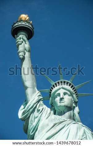 close up pictures of statue of liberty with blue sky