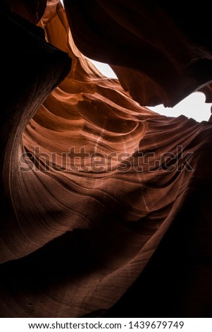 Beautiful wide angle view of amazing sandstone formations in famous Antelope Canyon on a sunny day with blue sky near the old town of Page.
