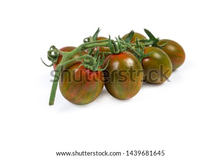 Cluster of the fresh ripe green with reddish brown cherry tomatoes kumato on a white background
